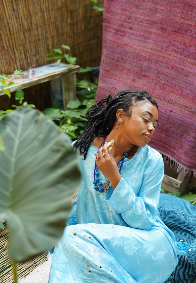 Female model applies perfume on her neck
