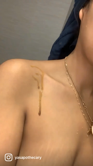 Gif of a female model applying the black seed oil on to her skin